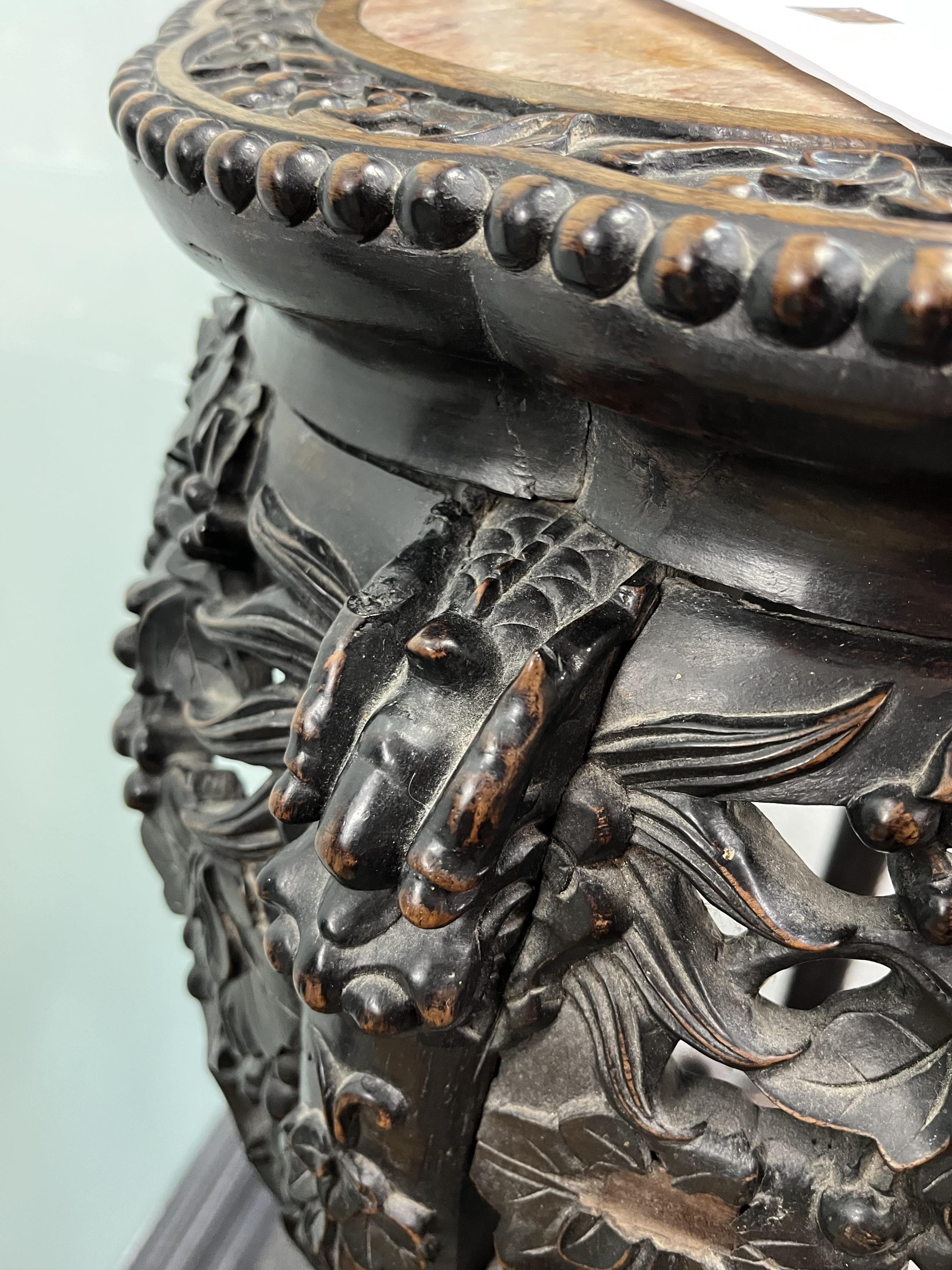 A Chinese carved hongmu rouge marble topped vase stand, diameter 42cm, height 93cm